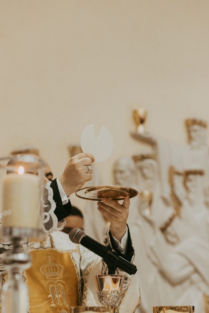 A man in a tuxedo holding a plate